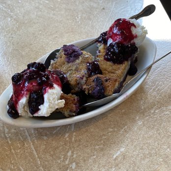 Cattlemen's Family Dining - Huckleberry cobbler served warm with homemade vanilla ice cream. - Cafes Near Me - Riggins, Idaho Cattlemen's Family Dining - Huckleberry cobbler served warm with homemade vanilla ice cream. - Cafes Near Me - Riggins, Idaho