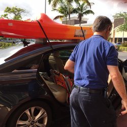 West Marine - Tomas helping me place the kayak on the roof of my car.