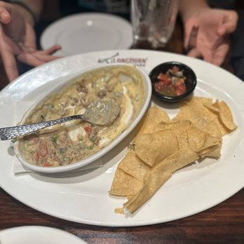 LongHorn Steakhouse - Texas Brisket Queso with pico on the side. - Steakhouses Near Me - San Antonio, Texas LongHorn Steakhouse - Texas Brisket Queso with pico on the side. - Steakhouses Near Me - San Antonio, Texas