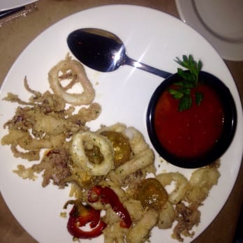 Nabruzzi Trattoria - Half-eaten calamari - Italian Near Me - Lutz, Florida Nabruzzi Trattoria - Half-eaten calamari - Italian Near Me - Lutz, Florida