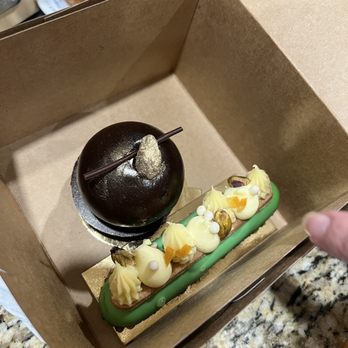 Sift Bake Shop - No idea what these are called - the round one was like a chocolate mousse bomb and the green one had pistachio nuts and cream - Bakeries Near Me - Mystic, Connecticut Sift Bake Shop - No idea what these are called - the round one was like a chocolate mousse bomb and the green one had pistachio nuts and cream - Bakeries Near Me - Mystic, Connecticut