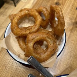 Honest Burgers Covent Garden - This place is seriously legit.  I ordered the  Kimchee burger with gluten free onion rings. Amazing service and delicious foods.