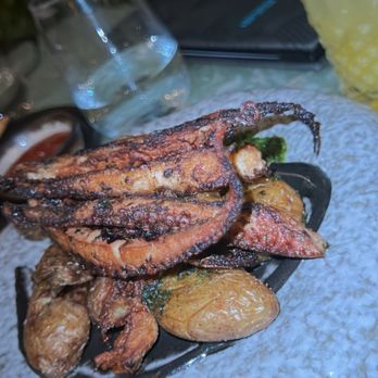 Rusty Pelican - Miami - Herb Marinated Grilled Octopus - Seafood Near Me - Key Biscayne, Florida Rusty Pelican - Miami - Herb Marinated Grilled Octopus - Seafood Near Me - Key Biscayne, Florida