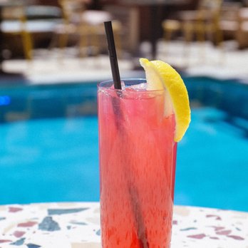 Pool Bar - a glass of watermelon drink with a lemon wedge - Salad Near Me - Oklahoma City, Oklahoma Pool Bar - a glass of watermelon drink with a lemon wedge - Salad Near Me - Oklahoma City, Oklahoma