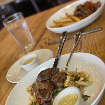 Embur - Peruvian fried rice in front and filet entree in back - Desserts Near Me - Greensboro, North Carolina