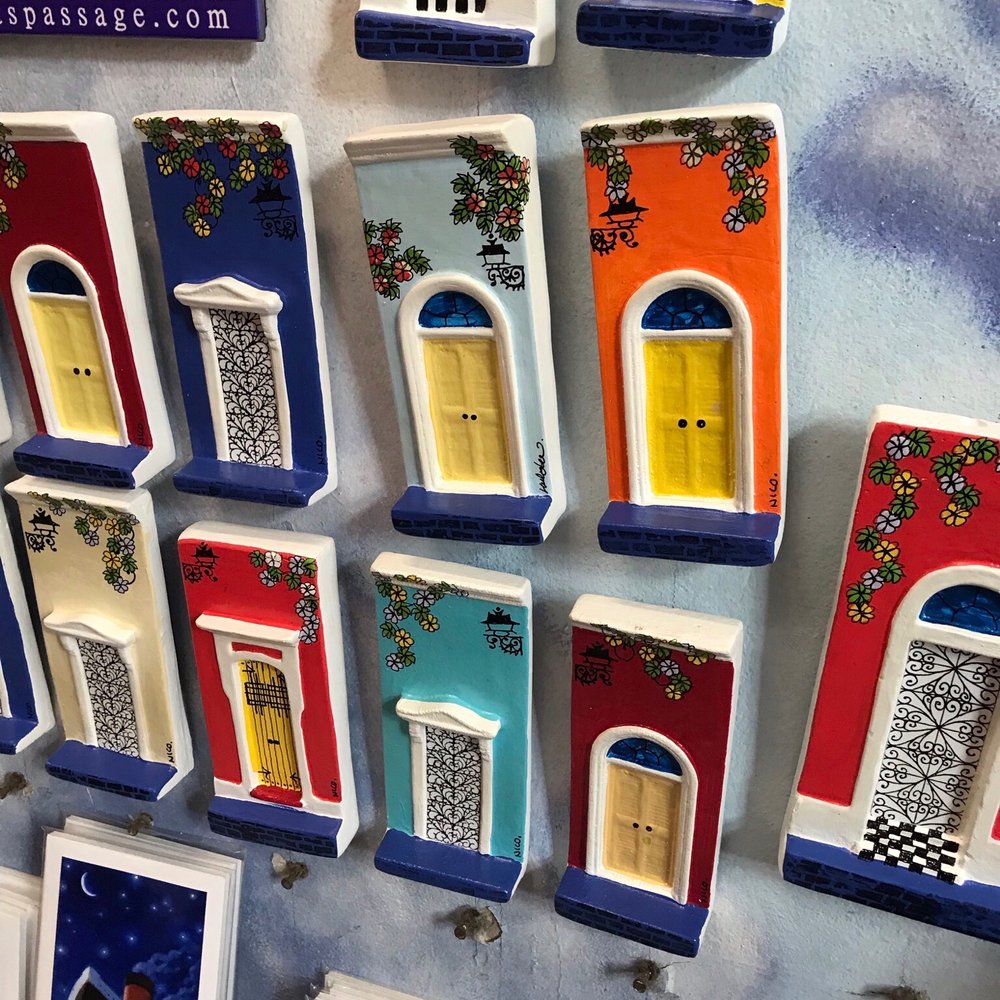The handmade ceramic doors they sell resemble the buildings in Old San Juan.