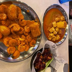 Hook & Reel Cajun Seafood & Bar - Pound of shrimp and half pound calamari.  BBQ chicken wings!