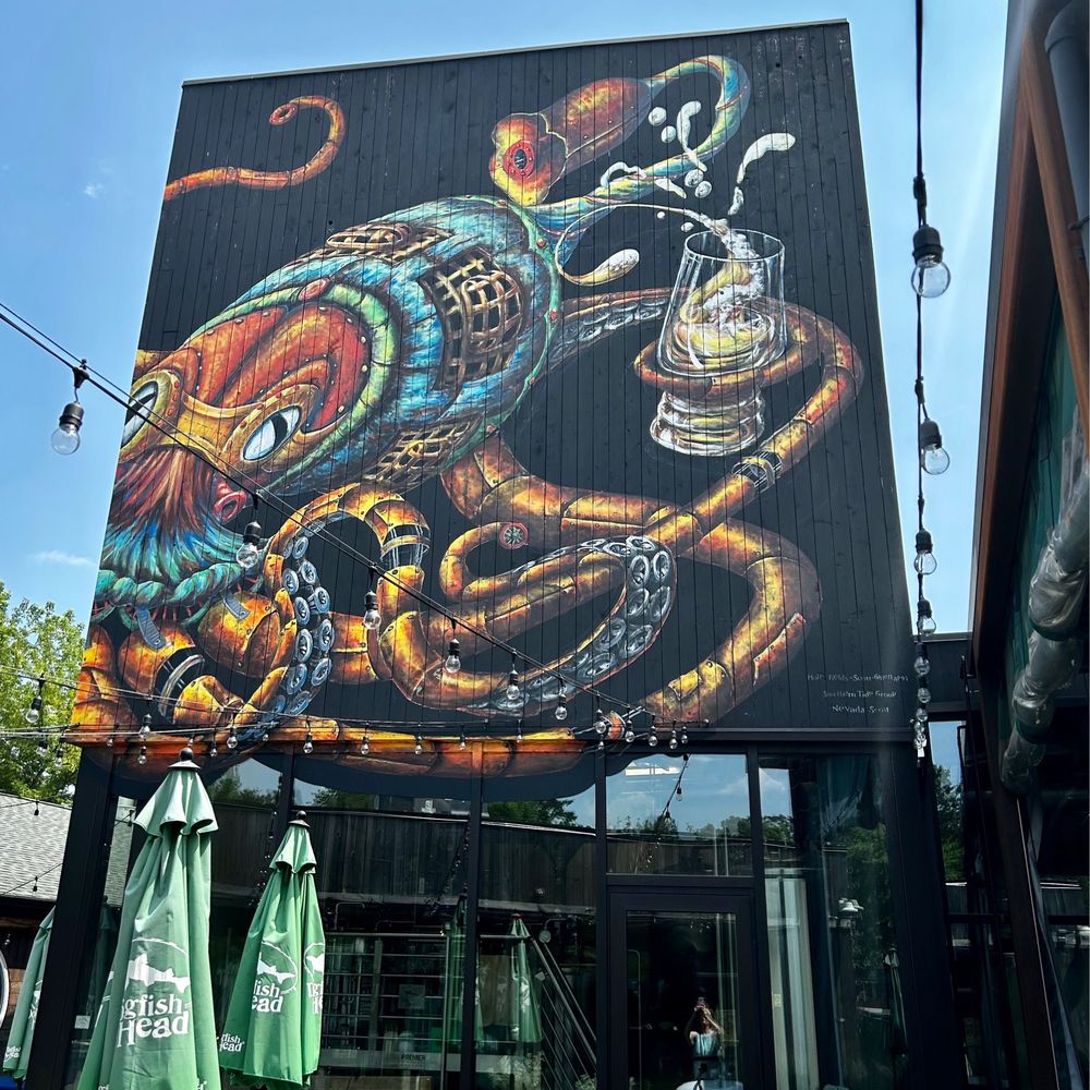 Dogfish Head Brewings & Eats - Great mural featuring an octopus - American Near Me - Rehoboth Beach, Delaware Dogfish Head Brewings & Eats - Great mural featuring an octopus - American Near Me - Rehoboth Beach, Delaware