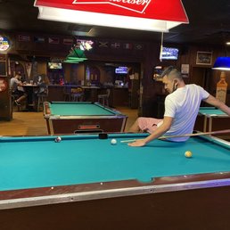 a man playing pool a man playing pool