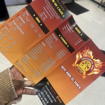 Phenomenal Ribs - a person holding a menu - Barbeque Near Me - Gary, Indiana Phenomenal Ribs - a person holding a menu - Barbeque Near Me - Gary, Indiana