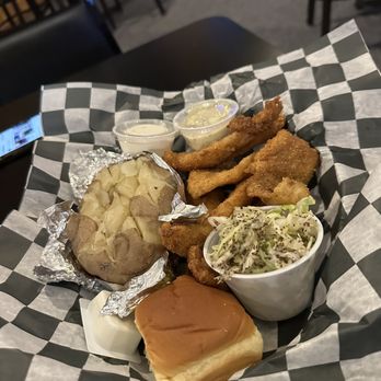 Wooded Island - Fish and chips dinner with baked potato instead of french fries - American Near Me - Caseville, Michigan Wooded Island - Fish and chips dinner with baked potato instead of french fries - American Near Me - Caseville, Michigan