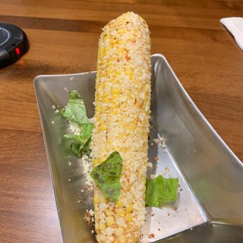 Rapids Brewery - Elote - fresh corn, roasted with wild child cream ale butter with grated cheese curds, paprika and basil. Yummy - Pizza Near Me - Grand Rapids, Minnesota