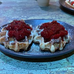 Crowaffles with strawberries, Nutella, and powdered sugar Crowaffles with strawberries, Nutella, and powdered sugar