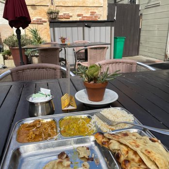 Batika India Bistro - New style of lunch, served on a metal tray, patio dining. Lamb curry. - Indian Near Me - Novato, California Batika India Bistro - New style of lunch, served on a metal tray, patio dining. Lamb curry. - Indian Near Me - Novato, California