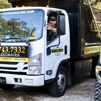 Countryside Hauling - Our Dump Truck with crew member waving - Junk Removal & Hauling Near Me - Tallahassee, Florida Countryside Hauling - Our Dump Truck with crew member waving - Junk Removal & Hauling Near Me - Tallahassee, Florida