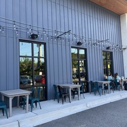 Side of building close to the parking lot seating.
