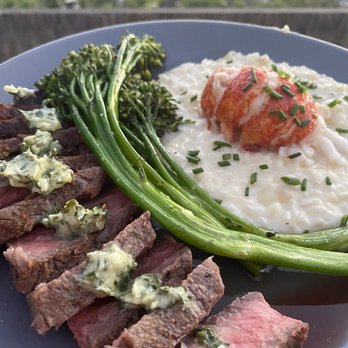 Daily Chew Catering - Lobster risotto, broccolini, and steak with herb butter - Caterers Near Me Daily Chew Catering - Lobster risotto, broccolini, and steak with herb butter - Caterers Near Me