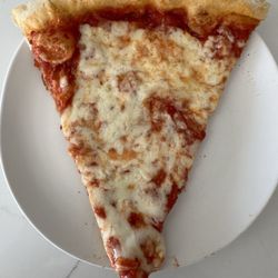 Vinny's Pizzeria - Reg slice. I order pies cooked lightly