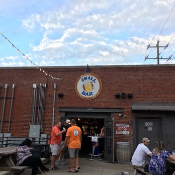 Small Bar - a group of people sitting at picnic tables - Bars Near Me - Charlotte, North Carolina