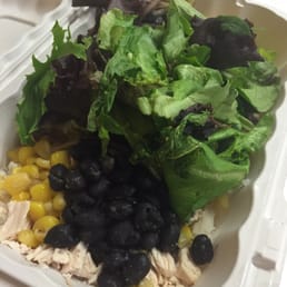 Chicken rice bowl with corn, beans and lettuce.