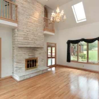 VAM Construction & Remodeling - a living room with a fireplace - Flooring Near Me - Glendale, Arizona VAM Construction & Remodeling - a living room with a fireplace - Flooring Near Me - Glendale, Arizona