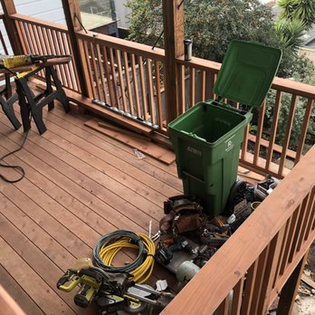 M & L Construction - a green trash can on a deck - General Contractors Near Me - San Francisco, California M & L Construction - a green trash can on a deck - General Contractors Near Me - San Francisco, California