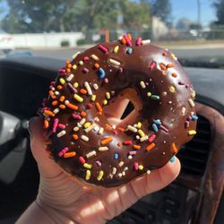 Dunkin' - Chocolate donut with rainbow sprinkles