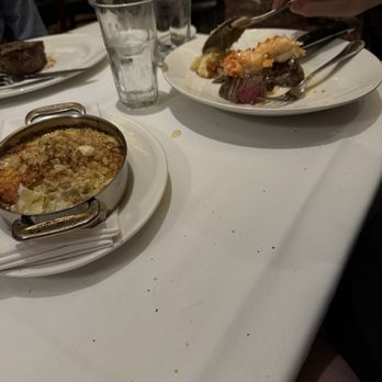 The Capital Grille - Au Gratin Potatoes, Seared Tenderloin with Butter Poached Lobster Tails, Filet Mignon 8oz - Steakhouses Near Me - Tampa, Florida The Capital Grille - Au Gratin Potatoes, Seared Tenderloin with Butter Poached Lobster Tails, Filet Mignon 8oz - Steakhouses Near Me - Tampa, Florida