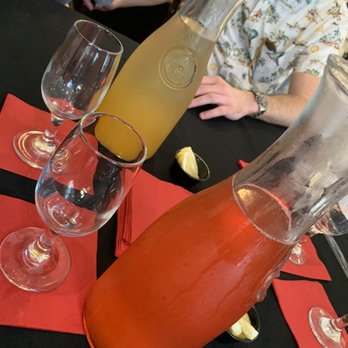 Upper Kirby Bistro - Peach and watermelon mimosa, SO GOOD and potent! - New American Near Me - Houston, Texas