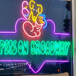 Exterior outside entrance of Pets On Broadway - Outside neon sign - Portland, Oregon Exterior outside entrance of Pets On Broadway - Outside neon sign - Portland, Oregon