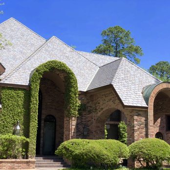 Stone Gate Roofing - Multi-width synthetic slate with aged copper radius dormers - Roofing Near Me - Houston, Texas