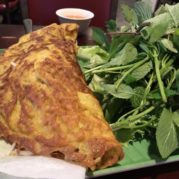 Rainier Restaurant - Banh Xeo - filled with bean sprouts, shrimp, pork. Fresh greens on the side - Vietnamese Near Me - Seattle, Washington Rainier Restaurant - Banh Xeo - filled with bean sprouts, shrimp, pork. Fresh greens on the side - Vietnamese Near Me - Seattle, Washington