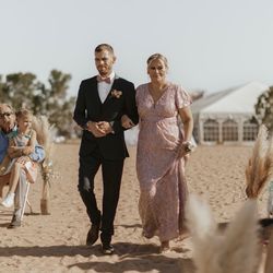 Elizabeth's Alterations - My son walking me down the aisle to be seated as mother of the bride in the dress Elizabeth fixed.