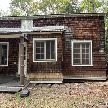 D&J Painting - "Before" - Note unstained new repair-shingles, and bare aluminum siding above porch roof. - Painters Near Me