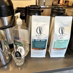 SkyRoast Coffee - Ordering counter - two bags of coffee for sale, hand sanitizer, and business cards