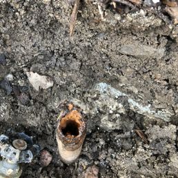 The busted and corroded pipe