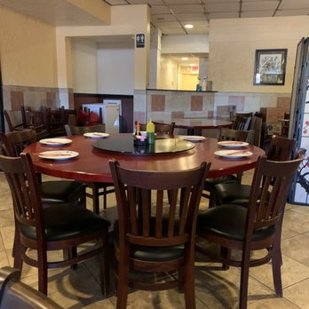 Ho Ho Choy - a table and chairs in a restaurant - Dim Sum Near Me - Tampa, Florida