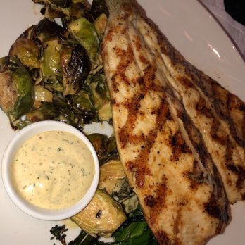 Seasons 52 - Wood grilled rainbow trout with brussel sprouts and broccolini - New American Near Me - Troy, Michigan
