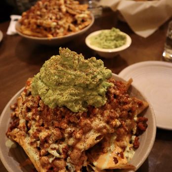 PlanTita's Kitchen - Queso Loaded Nachos with Drunken Beans (additional Al Pastor protein and scoop of guacamole) - Vegan Near Me - Long Beach, California PlanTita's Kitchen - Queso Loaded Nachos with Drunken Beans (additional Al Pastor protein and scoop of guacamole) - Vegan Near Me - Long Beach, California