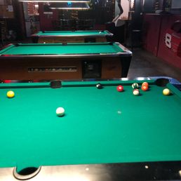 a pool table and pool balls a pool table and pool balls