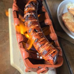 Raizes - Flaming Chouriço. Homemade spicy Portuguese sausage. Mild spicy, with a smokey tender meat. Very good.