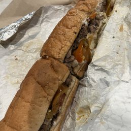 Big Man sub with sirloin, sauteed mushrooms, onions, and peppers, and provolone cheese Big Man sub with sirloin, sauteed mushrooms, onions, and peppers, and provolone cheese
