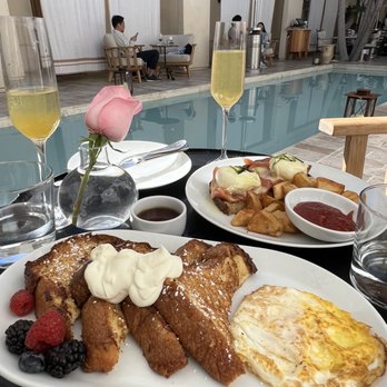 Cara Restaurant - French toast with a side of fried egg, salmon Benedict and passionfruit mimosas - New American Near Me - Los Angeles, California