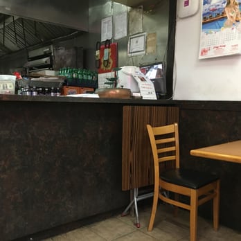 Lucky Foong - a table and a chair in a restaurant - Chinese Near Me - Spring Valley, New York Lucky Foong - a table and a chair in a restaurant - Chinese Near Me - Spring Valley, New York