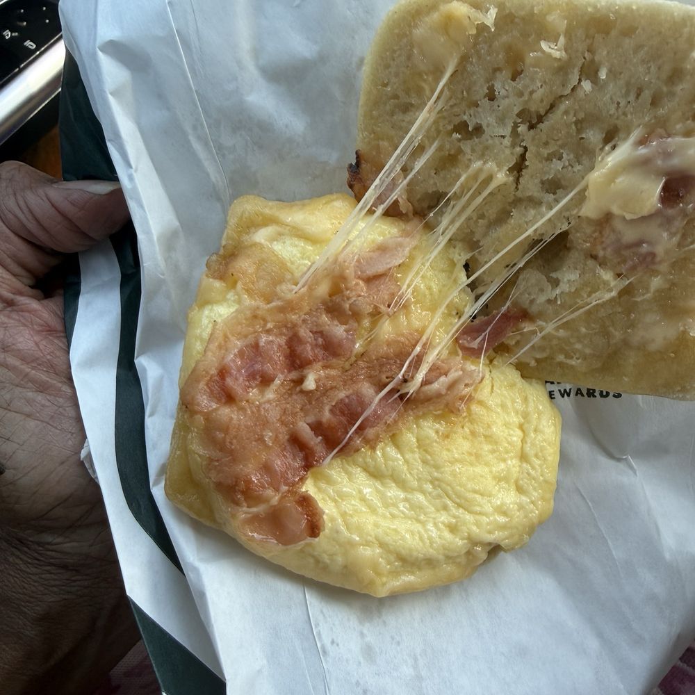 Starbucks Double-Smoked Bacon, Cheddar & Egg: Applewood-smoked bacon, cage-free egg, and sharp cheddar cheese on a croissant bun. Starbucks Double-Smoked Bacon, Cheddar & Egg: Applewood-smoked bacon, cage-free egg, and sharp cheddar cheese on a croissant bun.