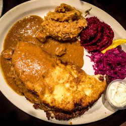 Orbit Bar & Restaurant - Hungarian potato pancake with beef goulash, fried sauerkraut, shredded beets, red cabbage slaw and sour cream!
