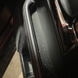 Budget Rent A Car - Popcorn kernels in the side panel of the front seat