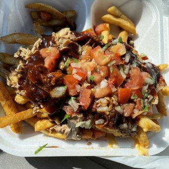 Wilma's Smokehouse - a plate of fries and a salad - Food Trucks Near Me