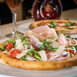 La Strada Italian Kitchen & Bar - Pizza Bianca (no red sauce), Prosciutto, Arugula, Cherry Tomato, Shaved Parmigiano