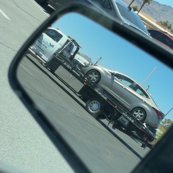 Tik's Quick Towing - Snapped from the rear view of my husband's car while Tik towed mine! - Towing Near Me - Las Vegas, Nevada Tik's Quick Towing - Snapped from the rear view of my husband's car while Tik towed mine! - Towing Near Me - Las Vegas, Nevada